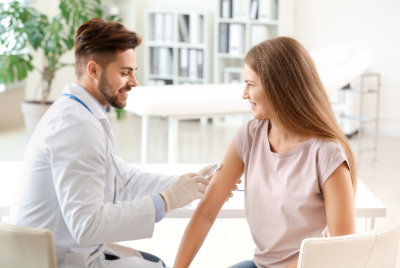 a doctor performing a injection to the patient