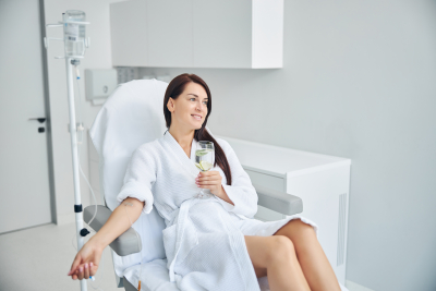 a happy woman smiling while taking therapy