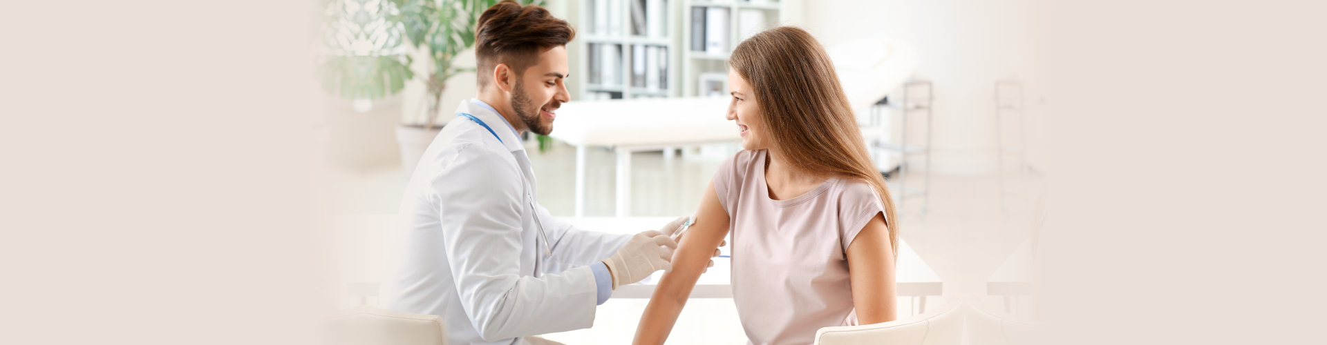 a doctor performing an injection to the patient
