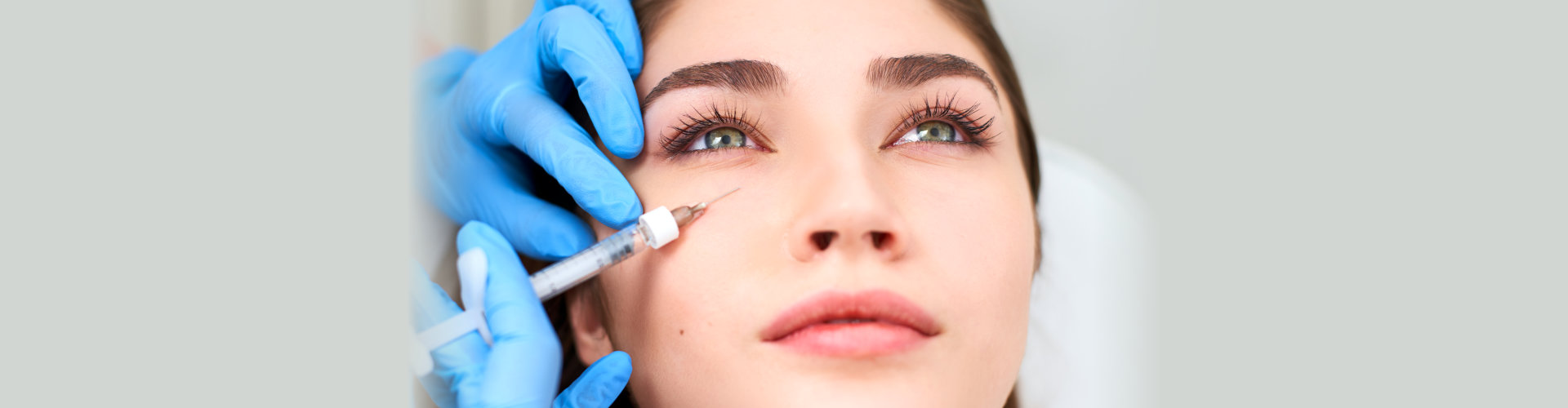 a young woman undergoing filler injection