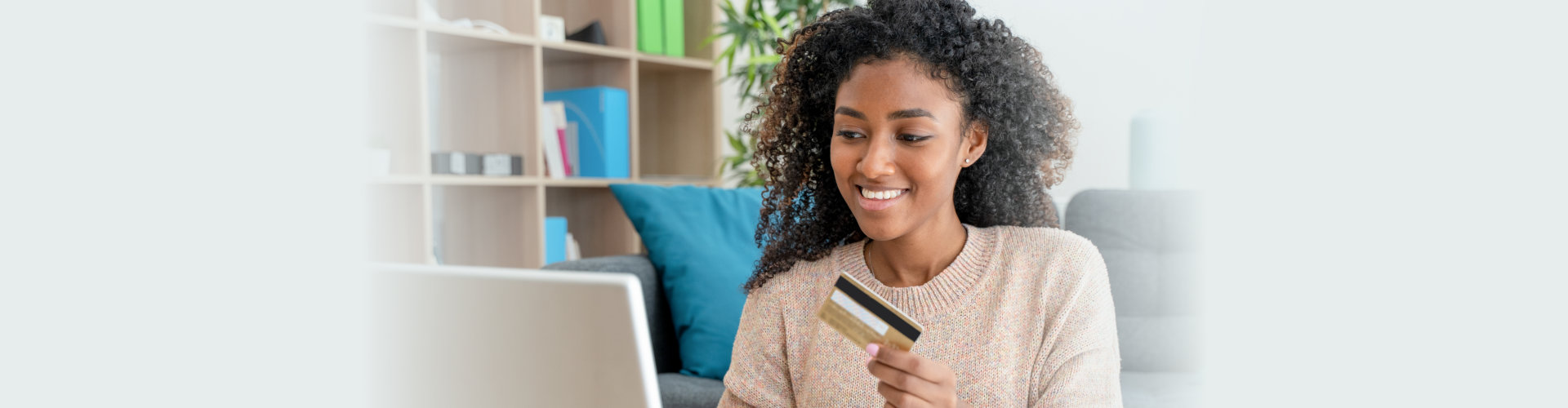 young woman paying via card