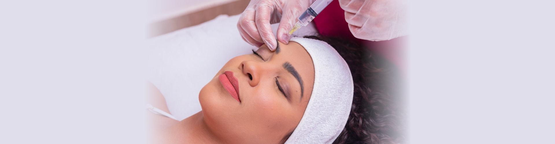 young woman getting rejuvenating injections